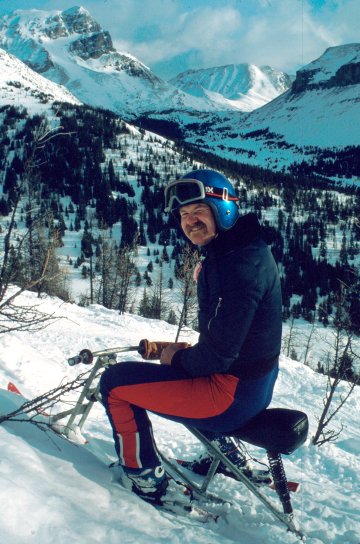 Dave Agnew pausing for a break on a fine morning. <br />Deception pass in the background. Lake Louise, 1984.